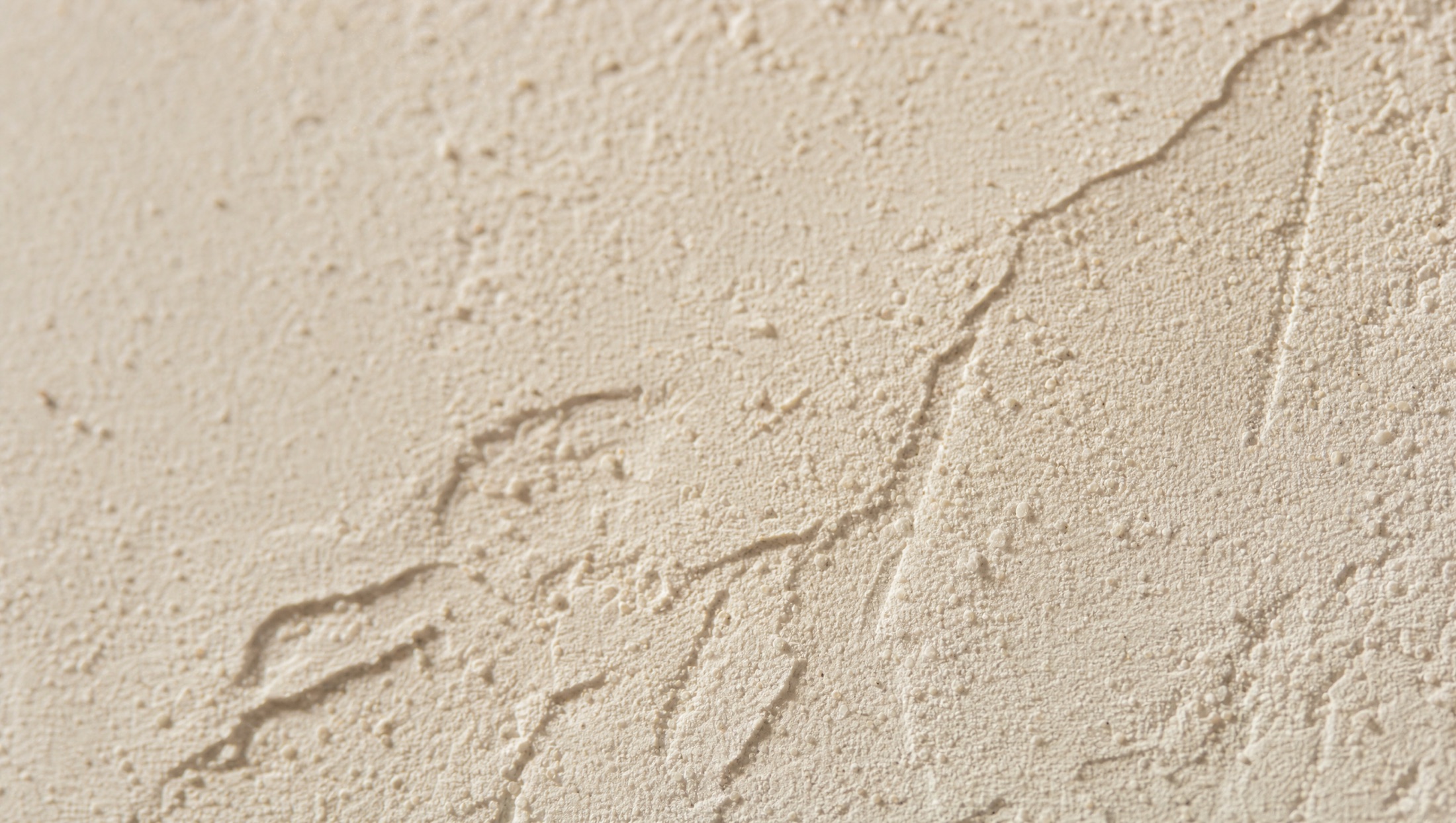Close-up van een wand met spachtelputz-structuur
